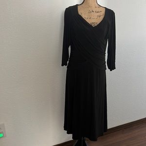 Black dress, v neck, wrap detail.
